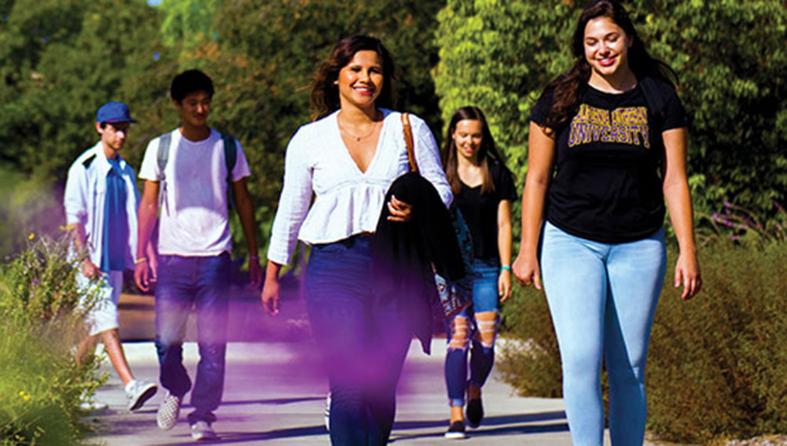 Group of students walking on campus