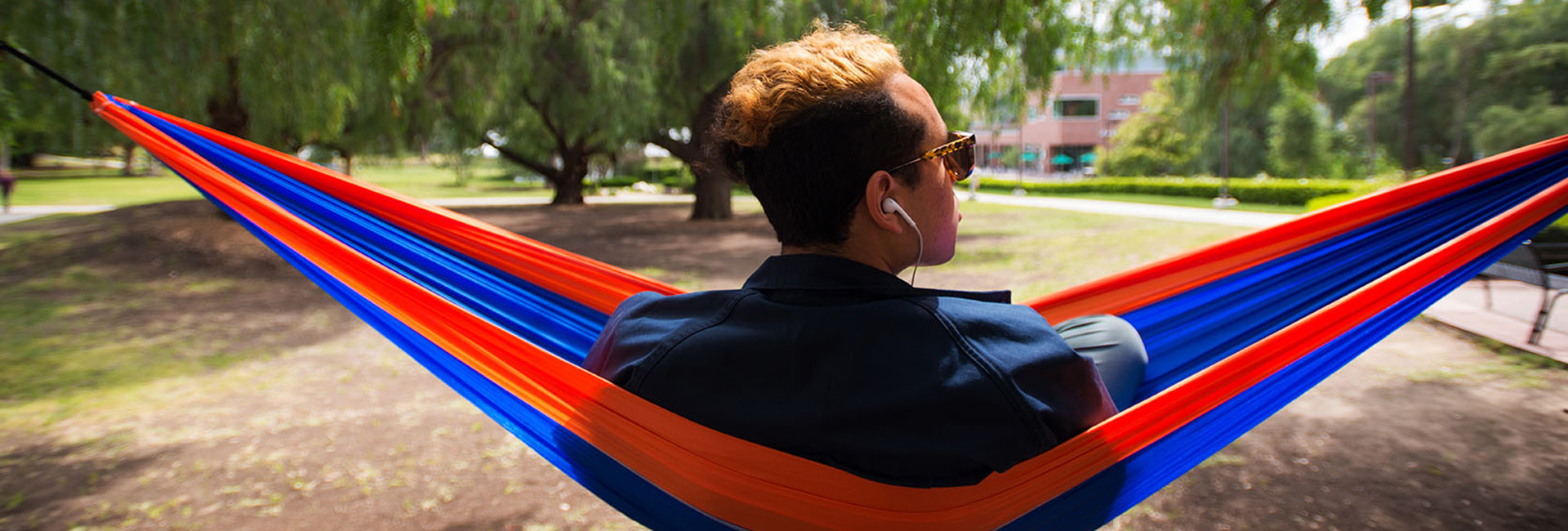 Student lounging in hammock